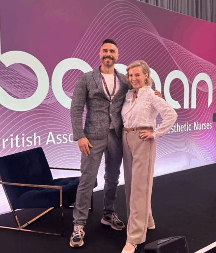 Dr James Olding and Nurse Julie Scott on the stage of the BAMAN conference.