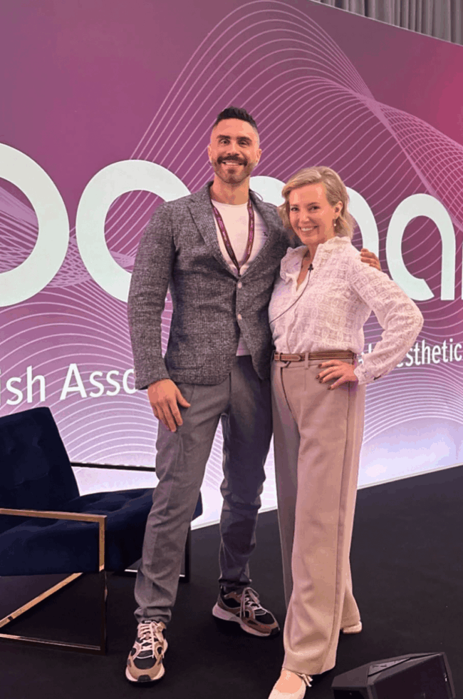 Dr James Olding and Nurse Julie Scott on the stage of the BAMAN conference.