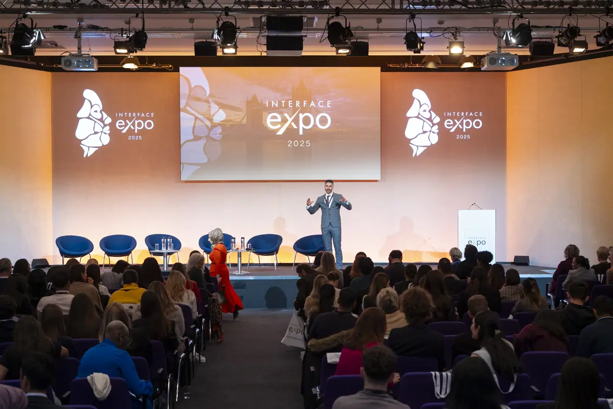 Dr James Olding on the stage of Interface Expo 2025, an aesthetic event created by Interface Aesthetics.